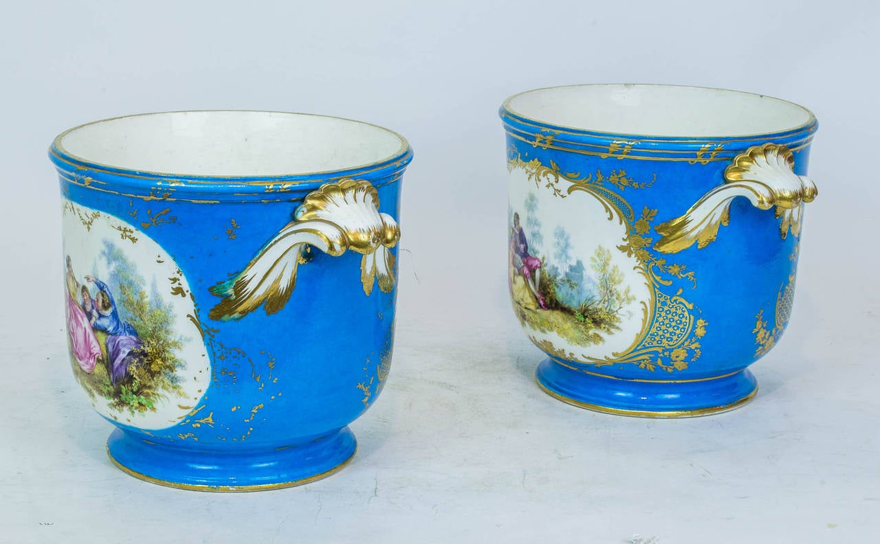 Pair of Celeste Blue Porcelain Sevres Cache Pots with Painted Love Scenes