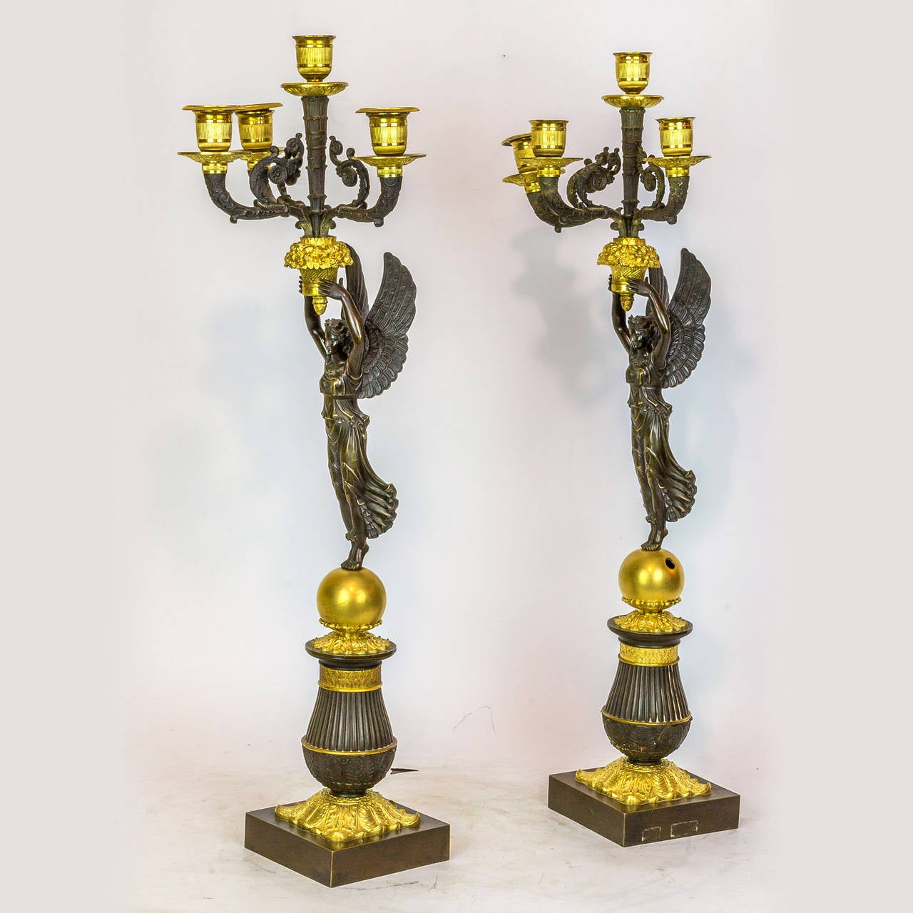 French Pair of Empire Style Gilt and Patinated Bronze Figural Candelabras