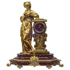 Gilt Bronze and Rouge Marble Figural Table Mantel Clock