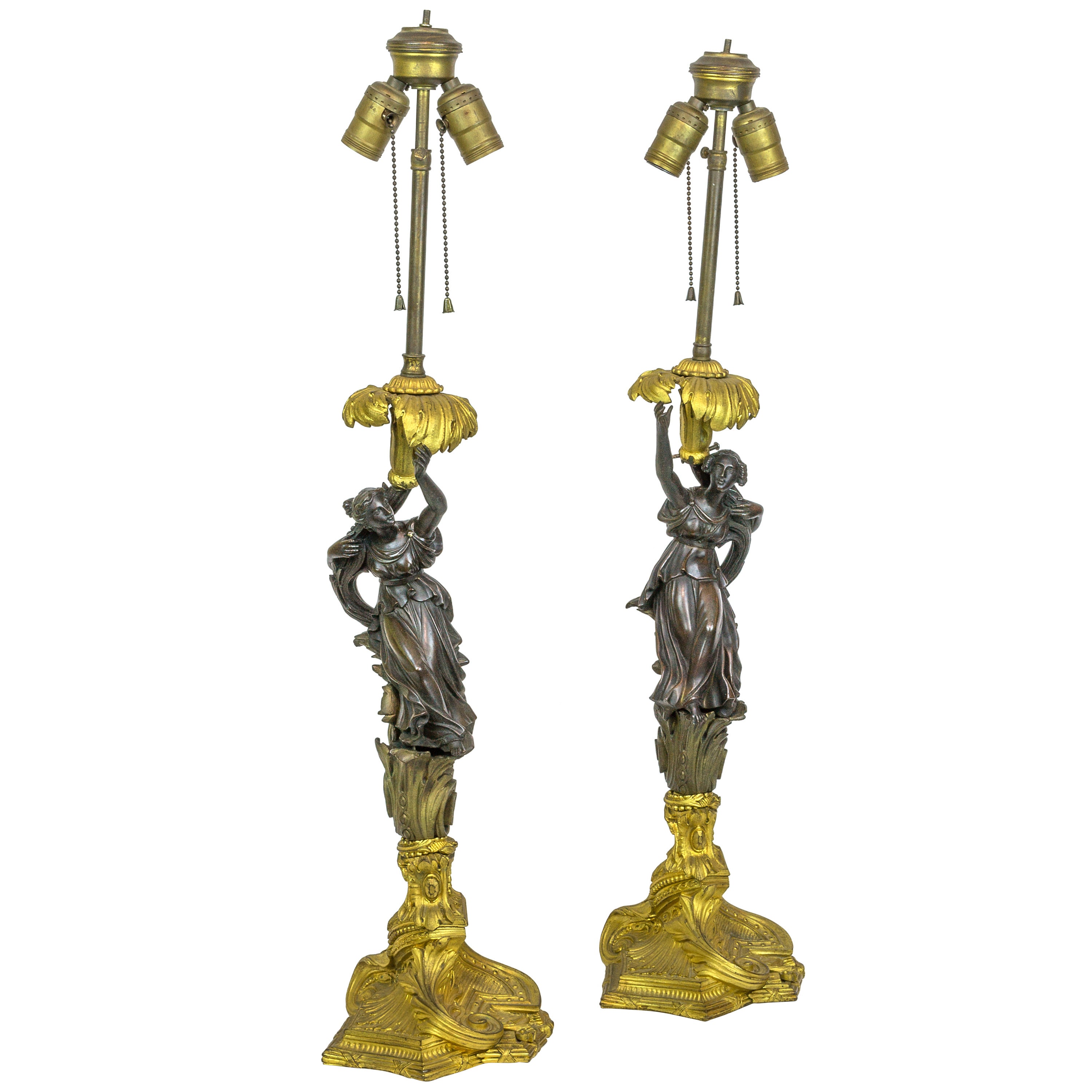 Pair of Patinated and Gilt Bronze Figural Candlestick Lamps