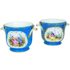 Pair of Celeste Blue Porcelain Sevres Cache Pots with Painted Love Scenes