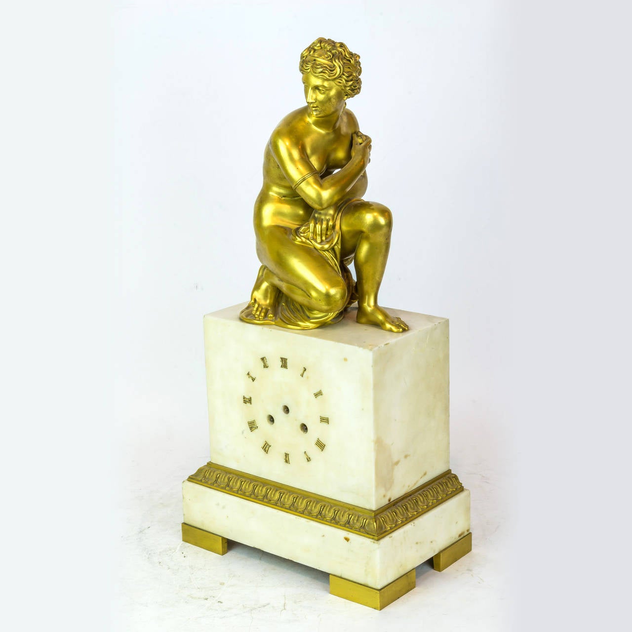 A gilt bronze and white marble neoclassical figural mantel clock
Stock number: CC36.
