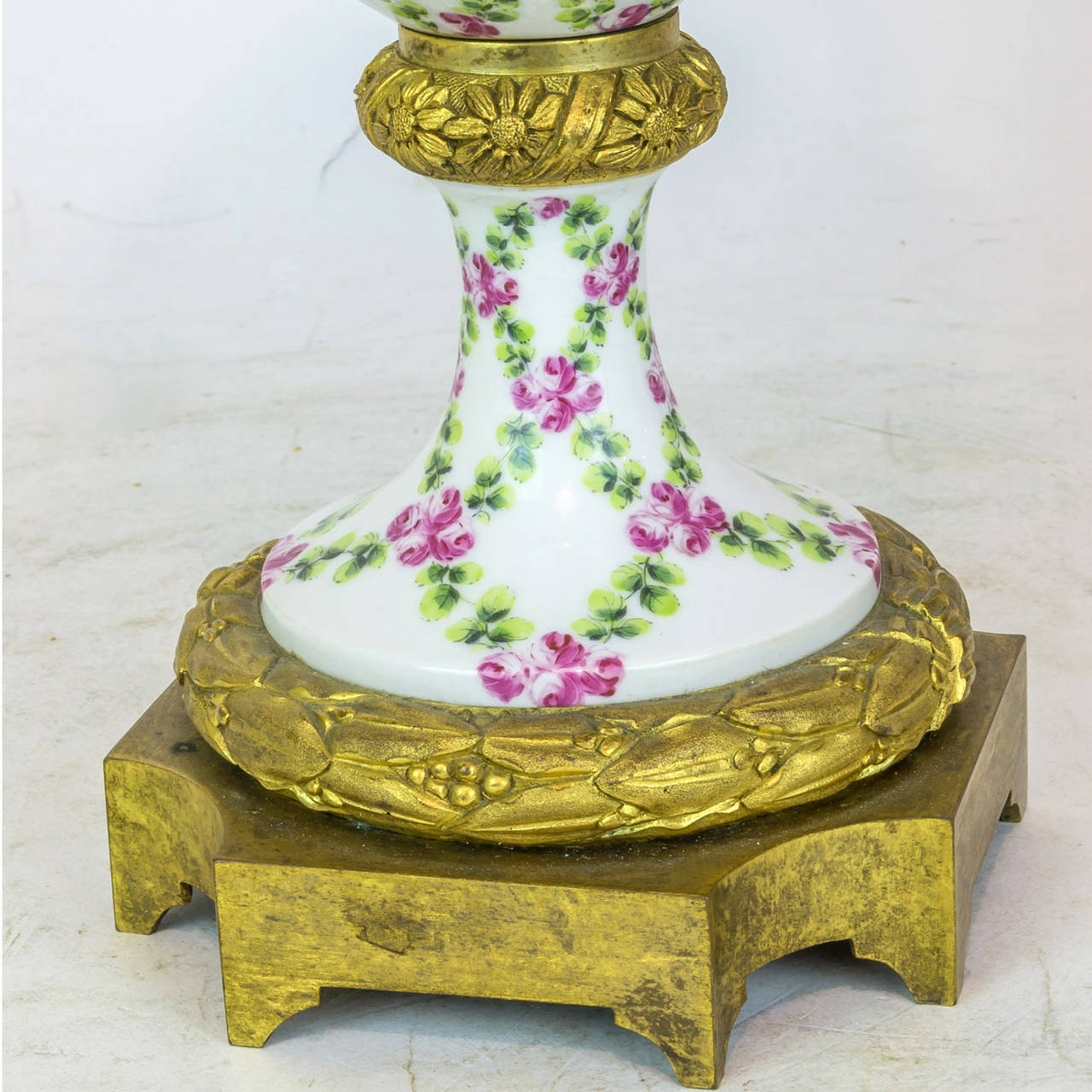 French Pair of Floral Painted Porcelain and Bronze Covered Urns