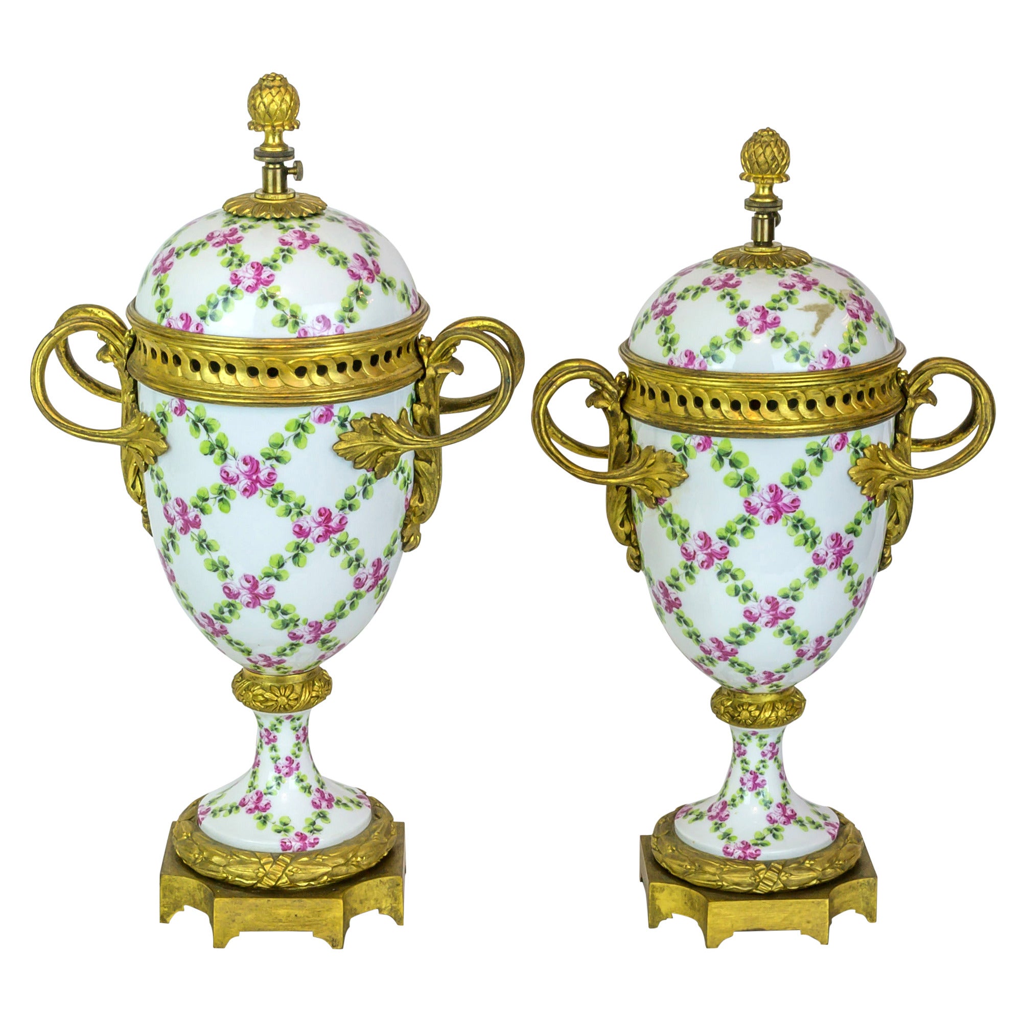 Pair of Floral Painted Porcelain and Bronze Covered Urns