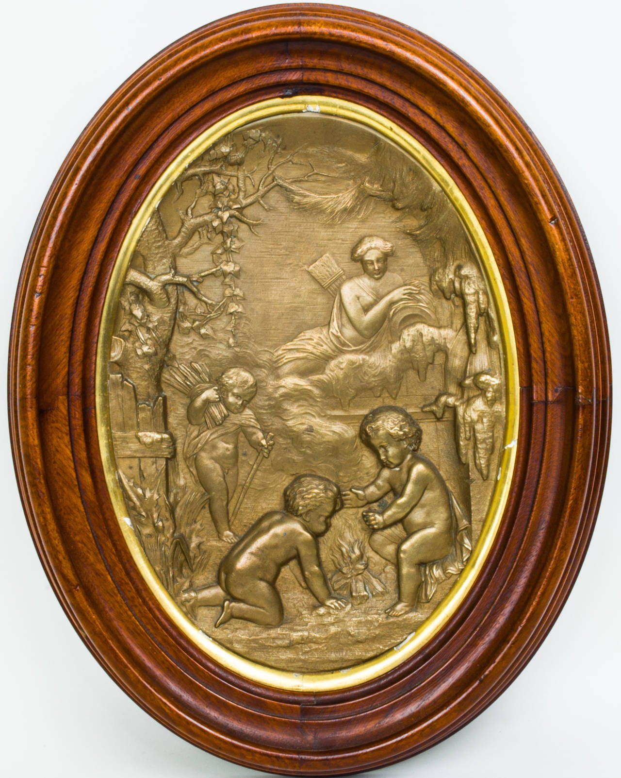Pair of Oval Patinated Metal Wall Plaques in Wood Frame with Cherub Decorations
Stock Number: PA7