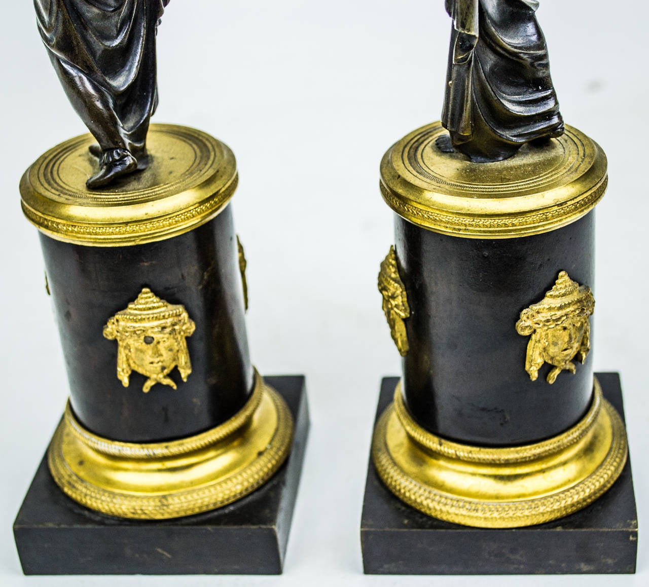 European Pair of French Gilt and Patinated Bronze Figural Candlesticks