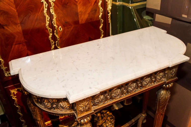 A very fine carved giltwood marble-top console with floral urn in middle.
Stock number: F18.