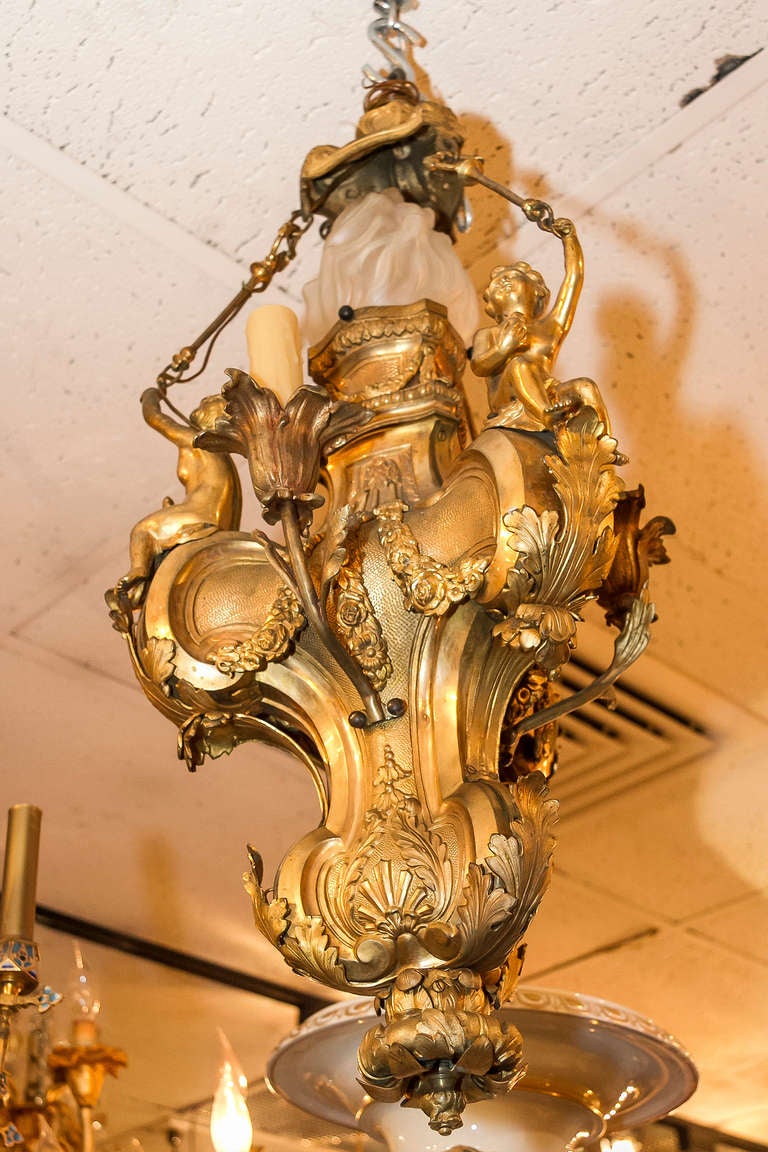 A Louis XV Style Gilt Bronze Figural 4 Light Cherub Chandelier In Good Condition In New York, NY