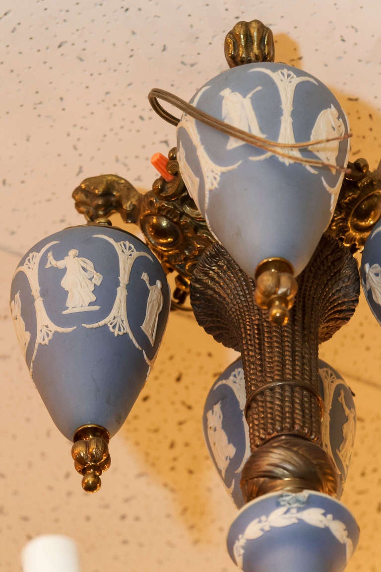 A Bronze and Wedgwood Blue and White 4 Light Chandelier with Classical Scenes