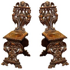 Antique Pair of carved wood figural side chairs