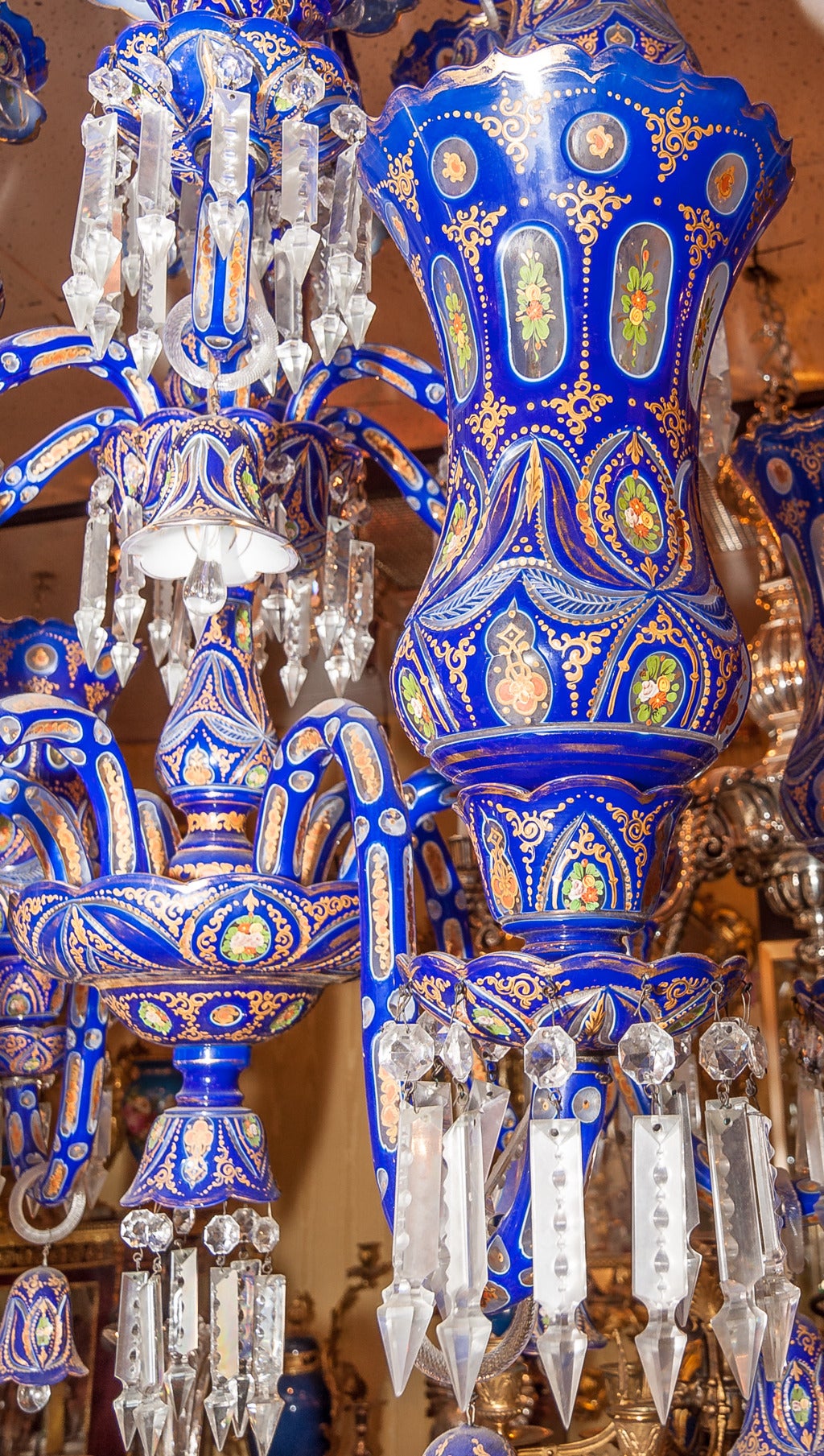 Spectacular bohemian blue to clear overlay glass palace size twelve-light chandelier with hurricane shade made for the Middle Eastern market.
Stock number: L366.