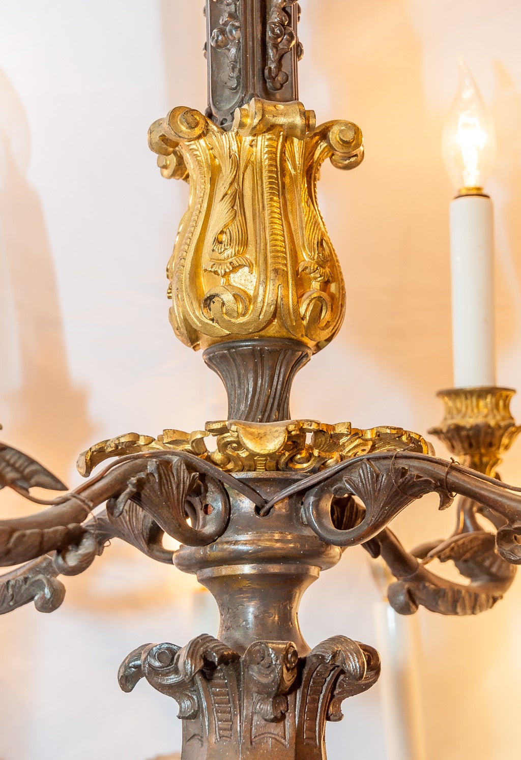 A 19th century French two-toned bronze Louis XIV style nineteen-light chandelier.
Stock number: L160