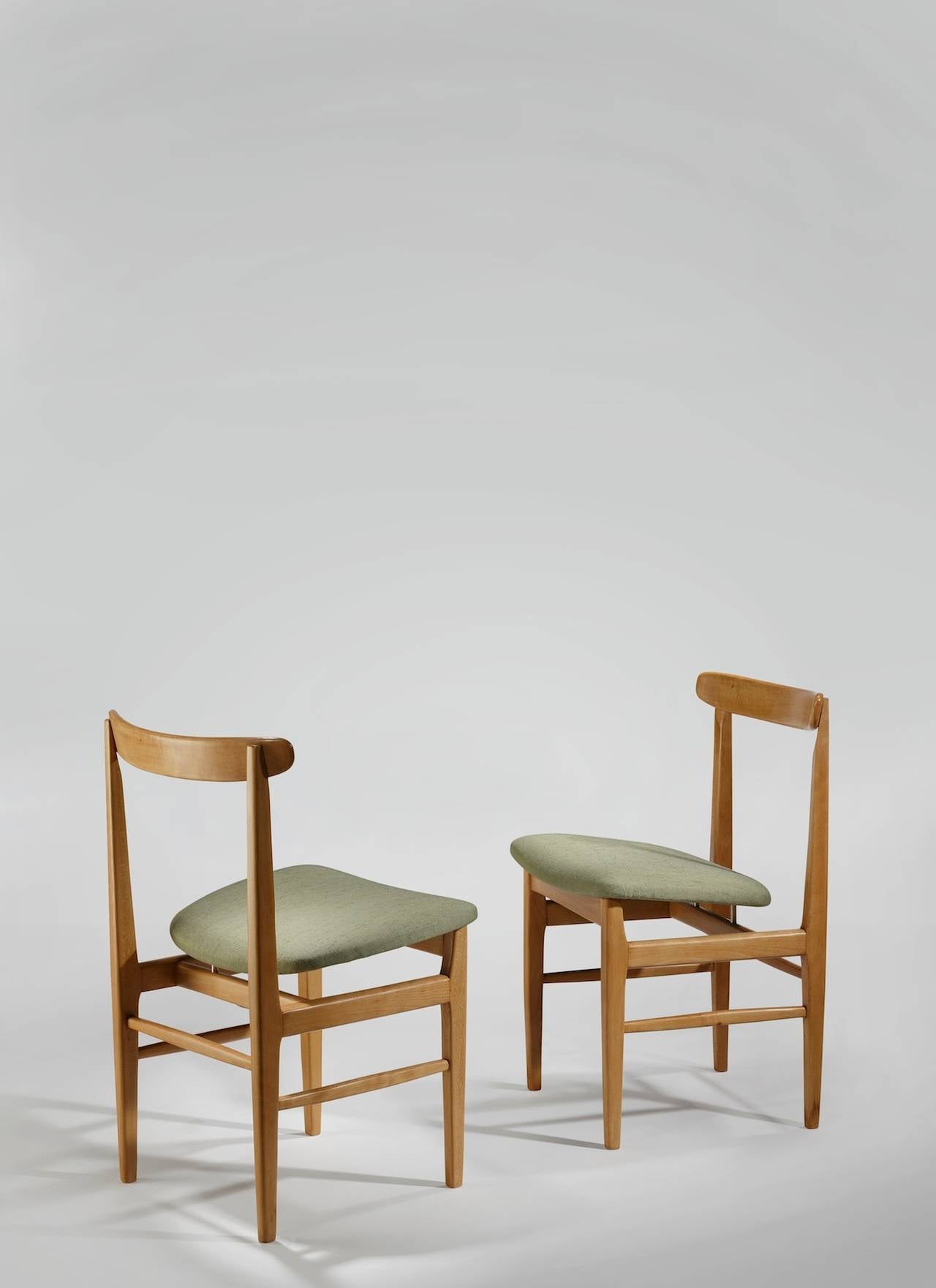 Set of four dining chairs by Rene´ Jean Caillette in frene (ash), foam and upholstery. Designed in 1955 and produced by Steiner.

About the designer: Rene´-Jean Caillette (1919–2004), was the son of a woodworker. He always intended to follow in