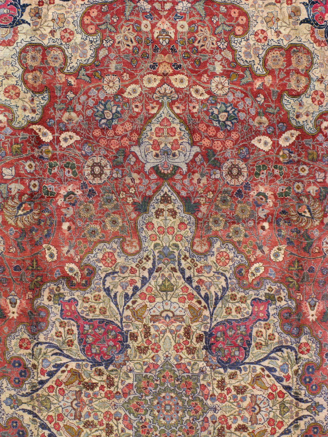 An antique Persian Tabriz carpet from the first quarter of the 20th century. Since the 19th century, Iran started exporting artisan carpets around the world, especially to Europe. Artists used one of the three versions of vertical looms later