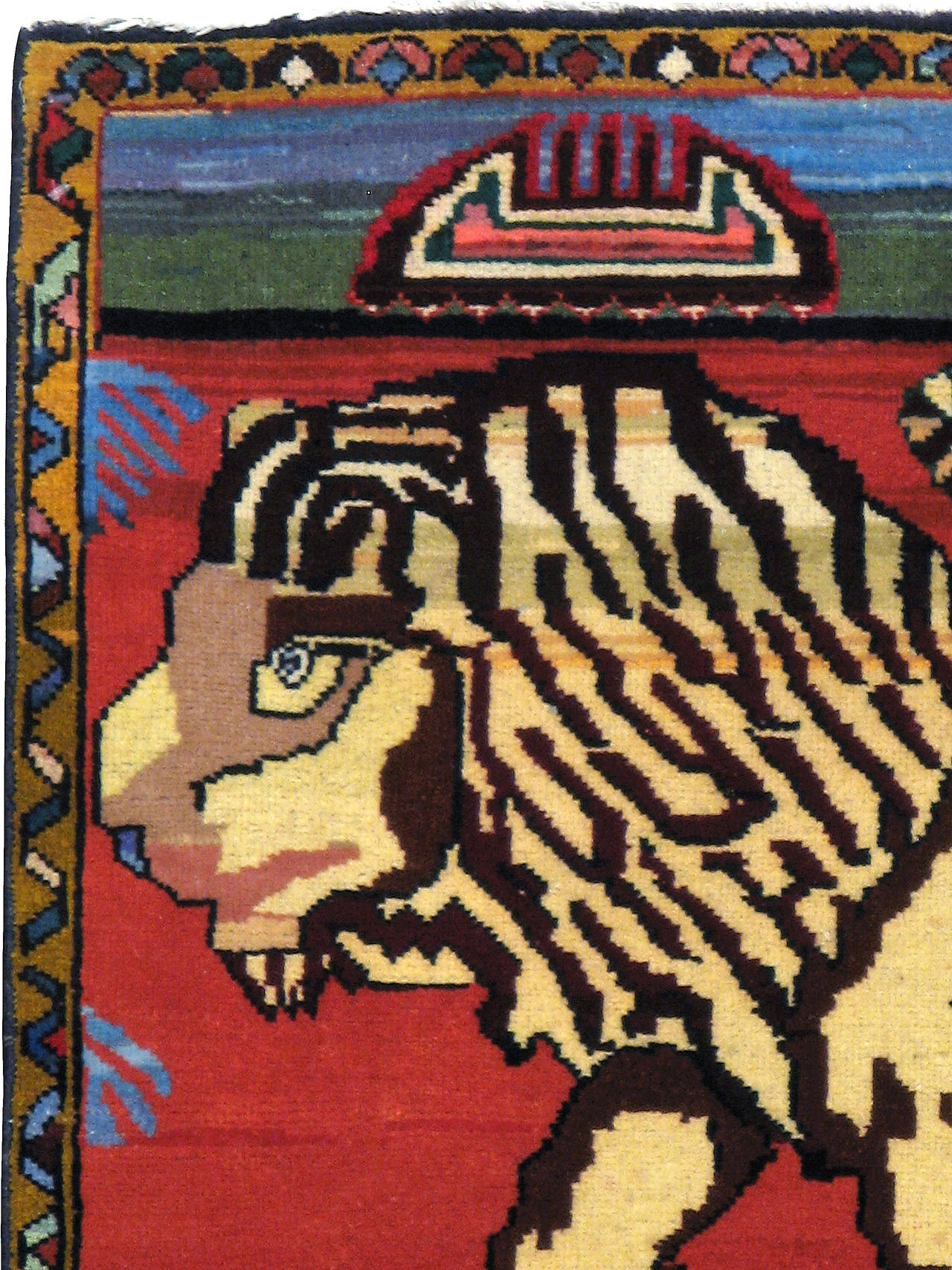 A vintage Persian Tabriz pictorial carpet from the second quarter of the 20th century depicting a male lion.