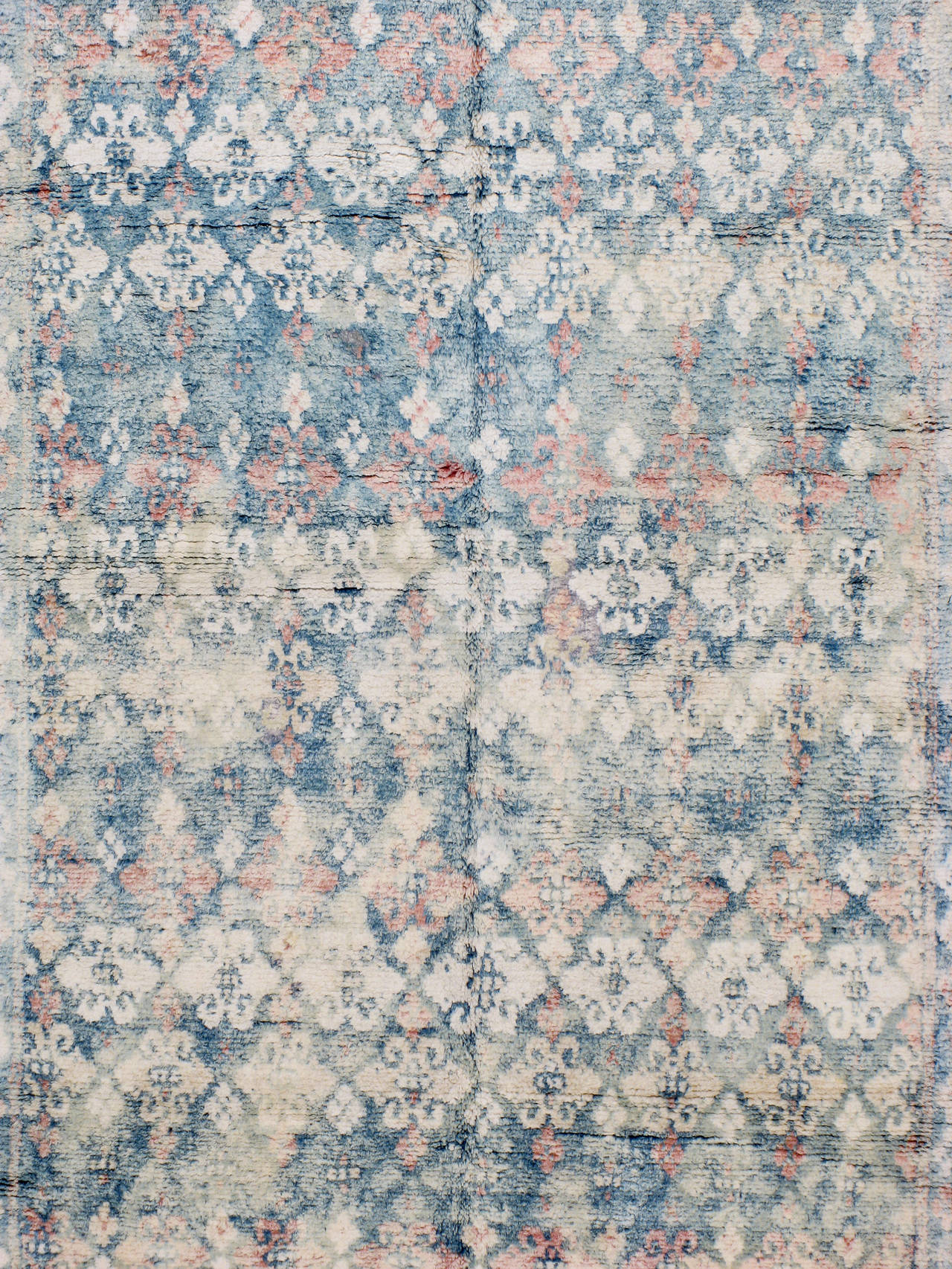 An antique Indian cotton Agra carpet from the second quarter of the 20th century.