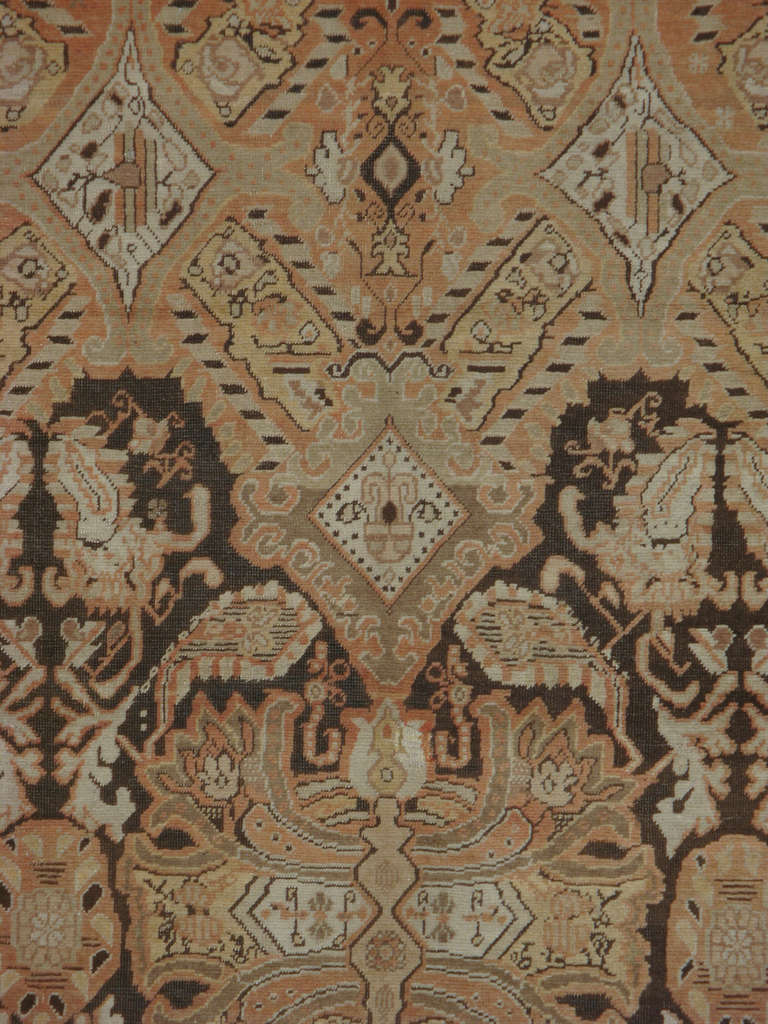 An early 20th century Russian Karabagh.  A Karabagh rug with tones of brown and orange.