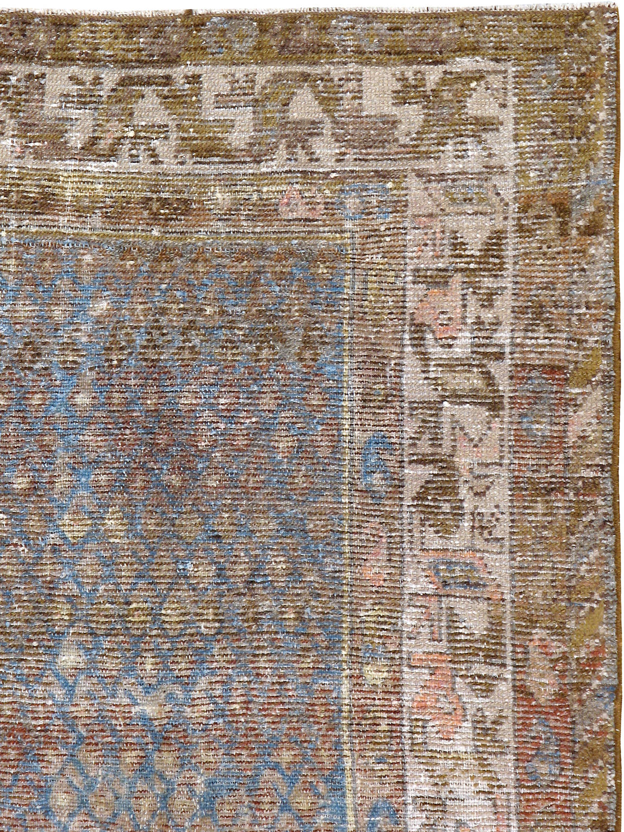 A weathered and distressed antique Malayer carpet from the first quarter of the 20th century. Malayer is one of over 100 weaving villages outside of Hamadan in Northwestern Iran. Malayer has many popular parks with lush greenery and colorful birds.