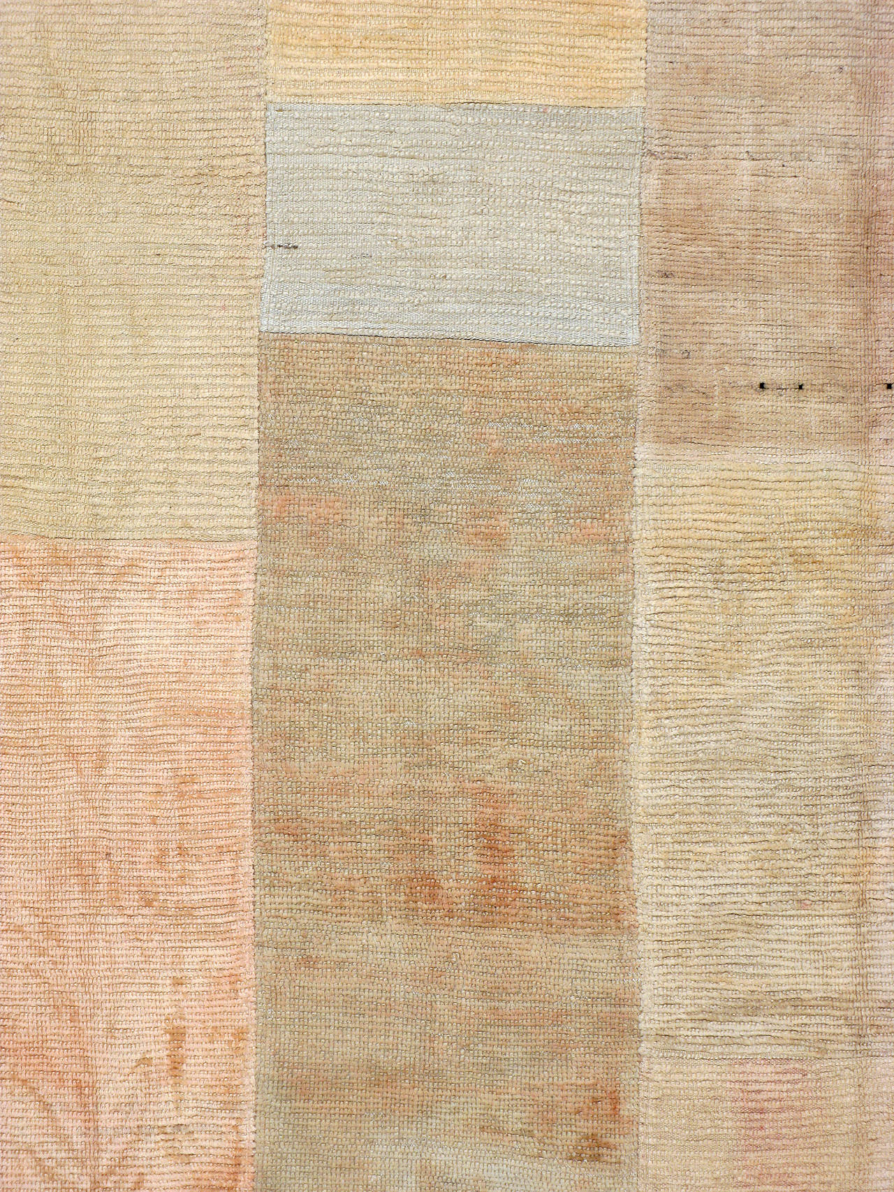 A Tulu carpet constructed of vintage Tulu carpets joined by hand-stitching.