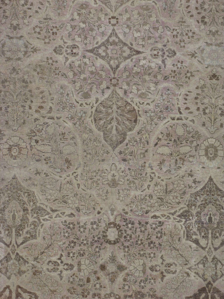 An early 20th century Persian Tabriz.  Since the 17th century, Iran started exporting artisan carpets around the world, especially to Europe.  Artists used one of the three versions of vertical looms later referred to as a Tabriz Loom.  Artists