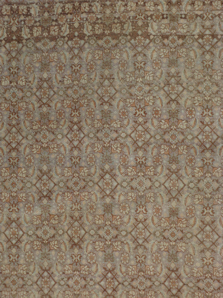 An early 20th century Persian Tabriz.  Since the 17th century, Iran started exporting artisan carpets around the world, especially to Europe.  Artists used one of the three versions of vertical looms later referred to as a Tabriz Loom.  Artists