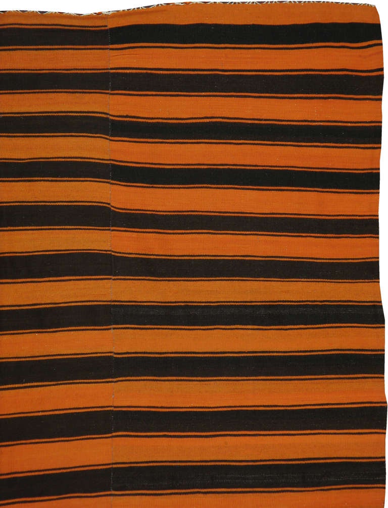 A traditional striped Kilim in an unconventional shade.