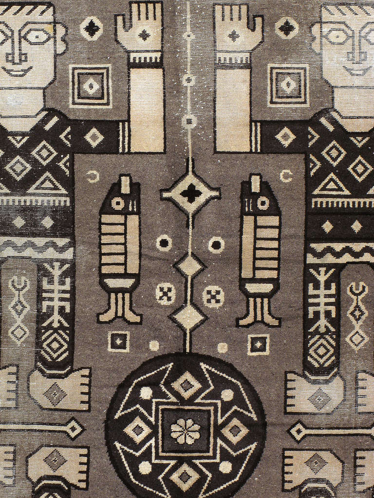 A second quarter, mid 20th century Indian carpet with a quirky pictorial design.
