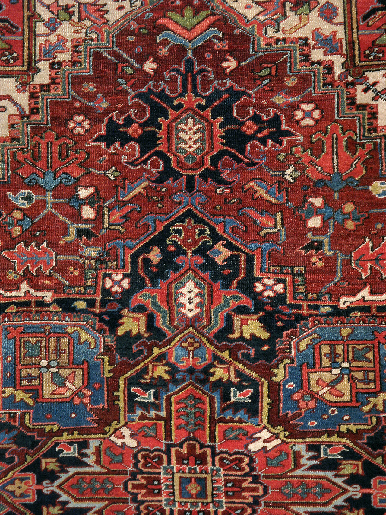 An antique Persian Heriz carpet from the second quarter of the 20th century.