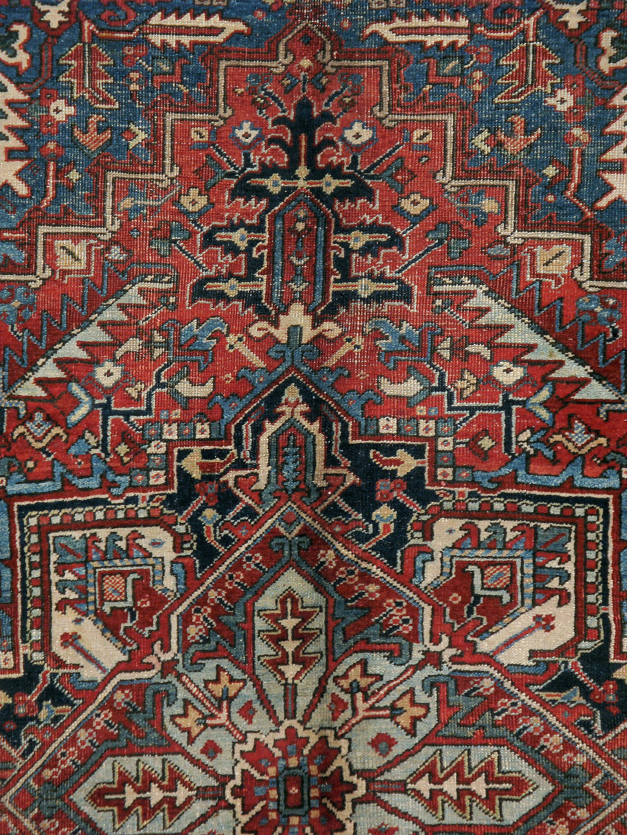 An antique Persian Heriz carpet from the first quarter of the 20th century.