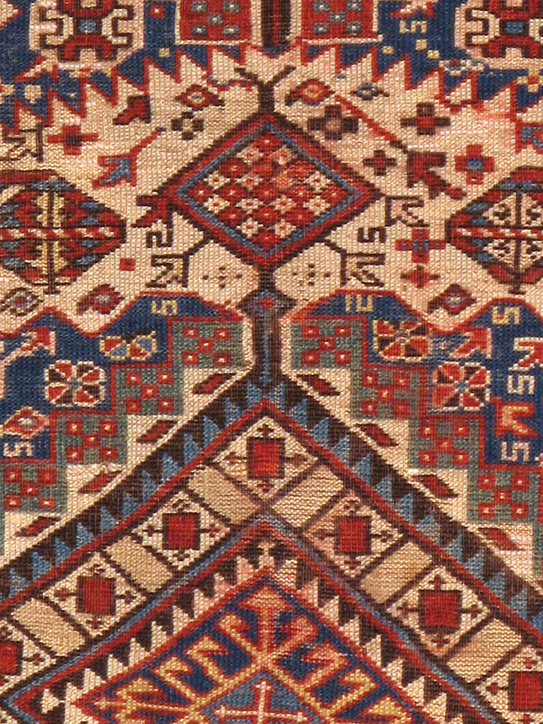 A turn of the 20th century Caucasian Shirvan carpet.