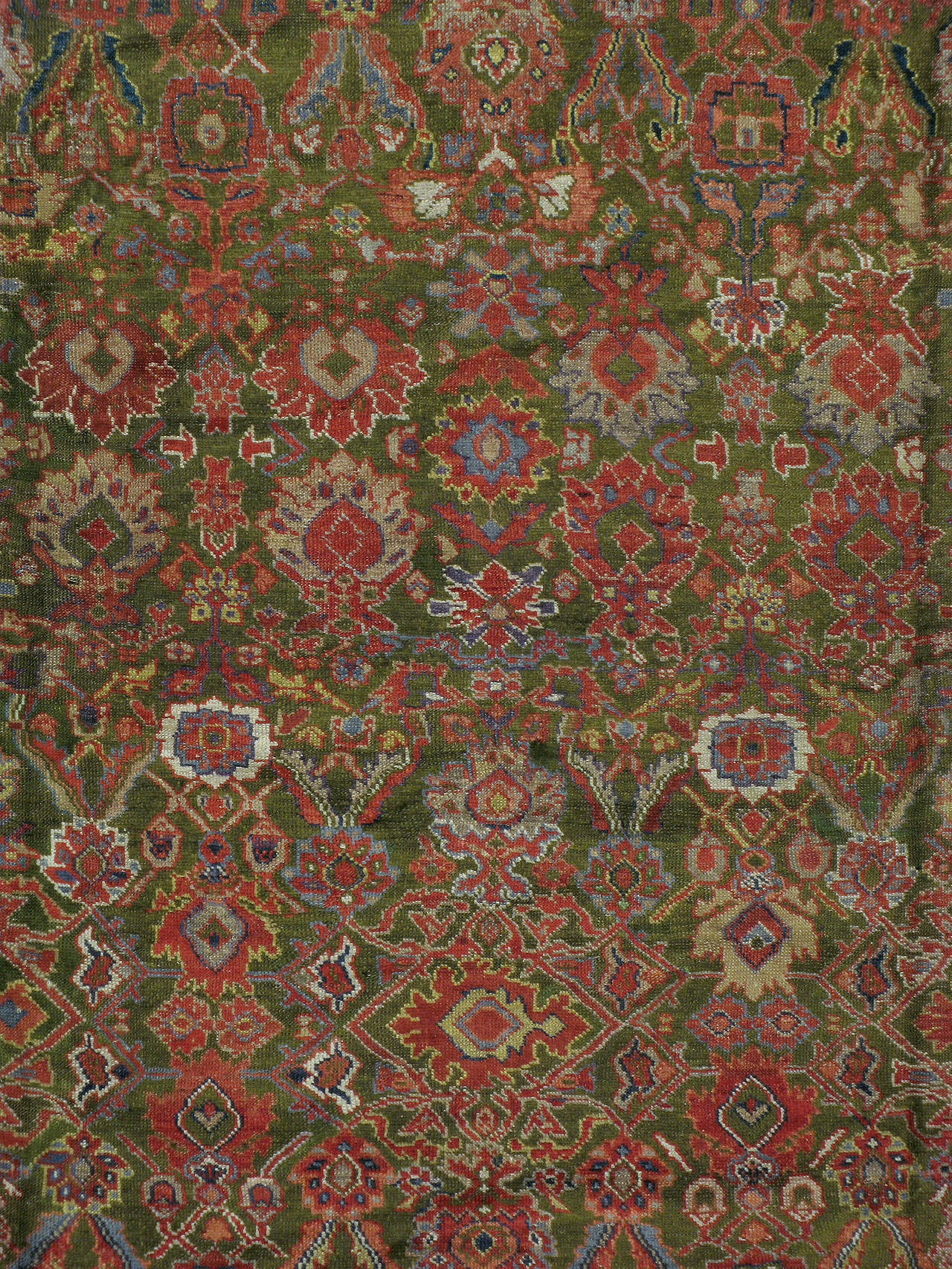 An antique Persian Sultanabad Mahal carpet from the turn of the 20th century.