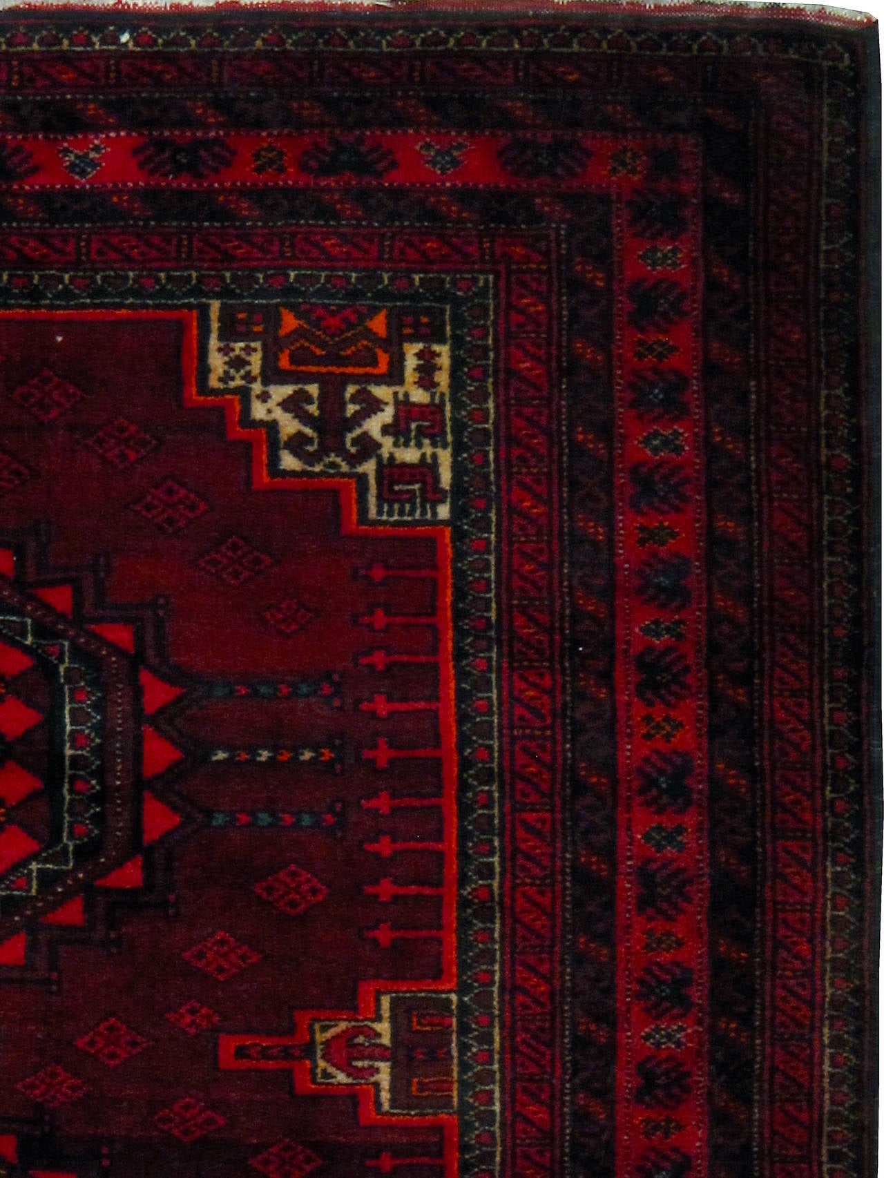 A vintage Central Asian Turkoman carpet from the mid-20th century.