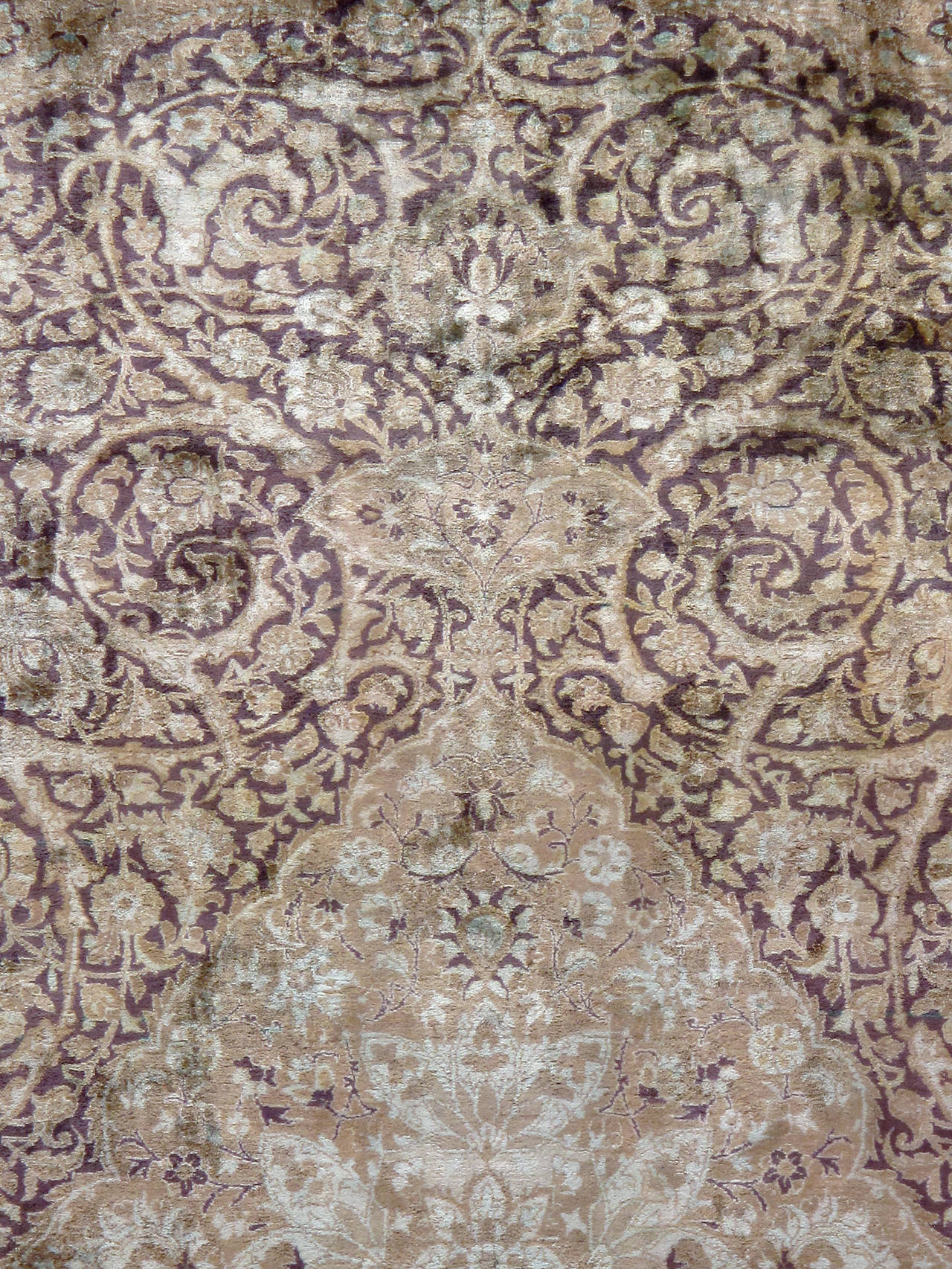 An antique Persian Silk Kashan carpet from the first quarter of the 20th century with an intricately woven arabesque vine scrolls design.

Measures: 7' 3