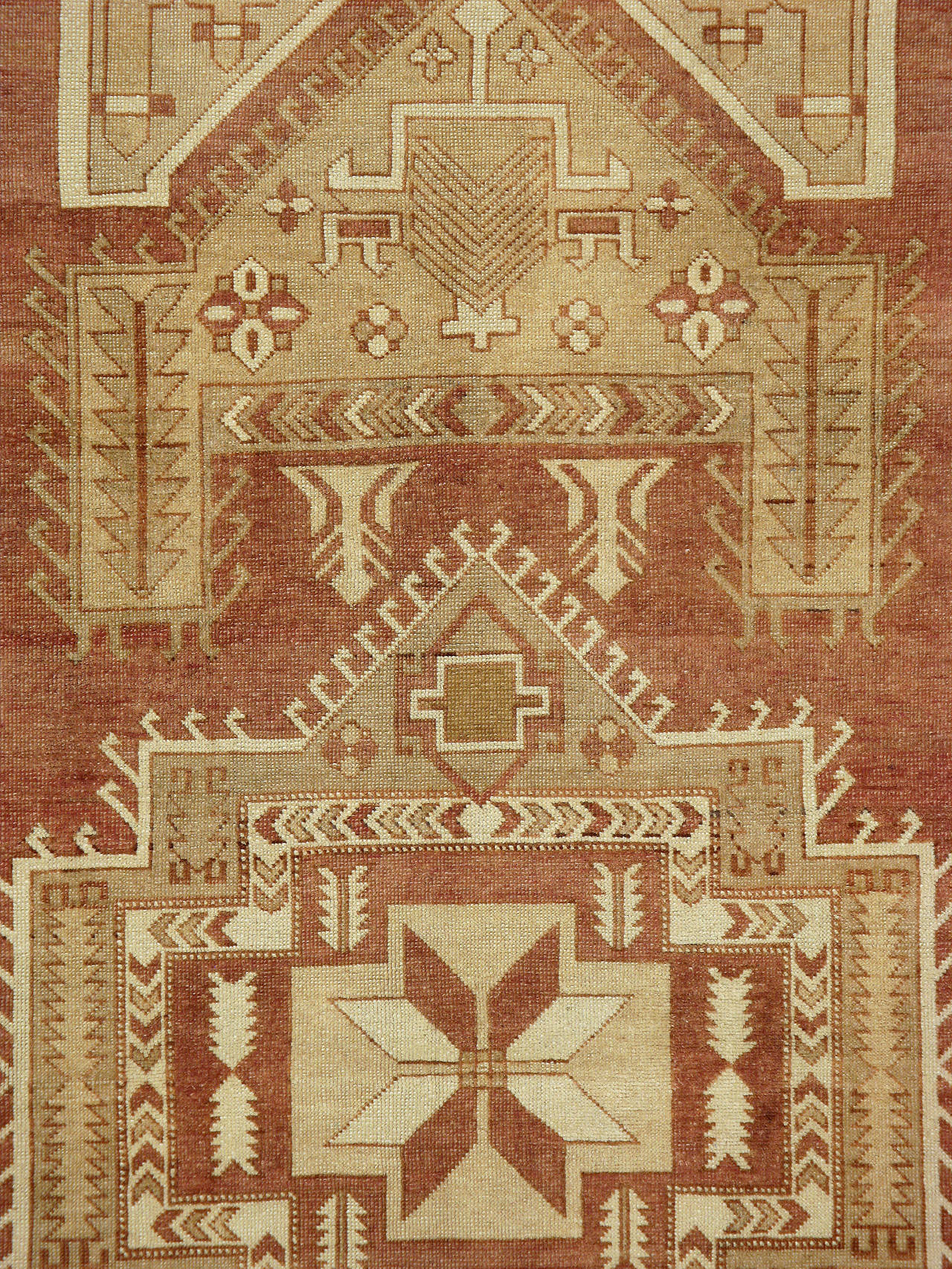 A vintage Turkish Anatolian carpet from the mid-20th century with a traditional medallion design over a terracotta field.