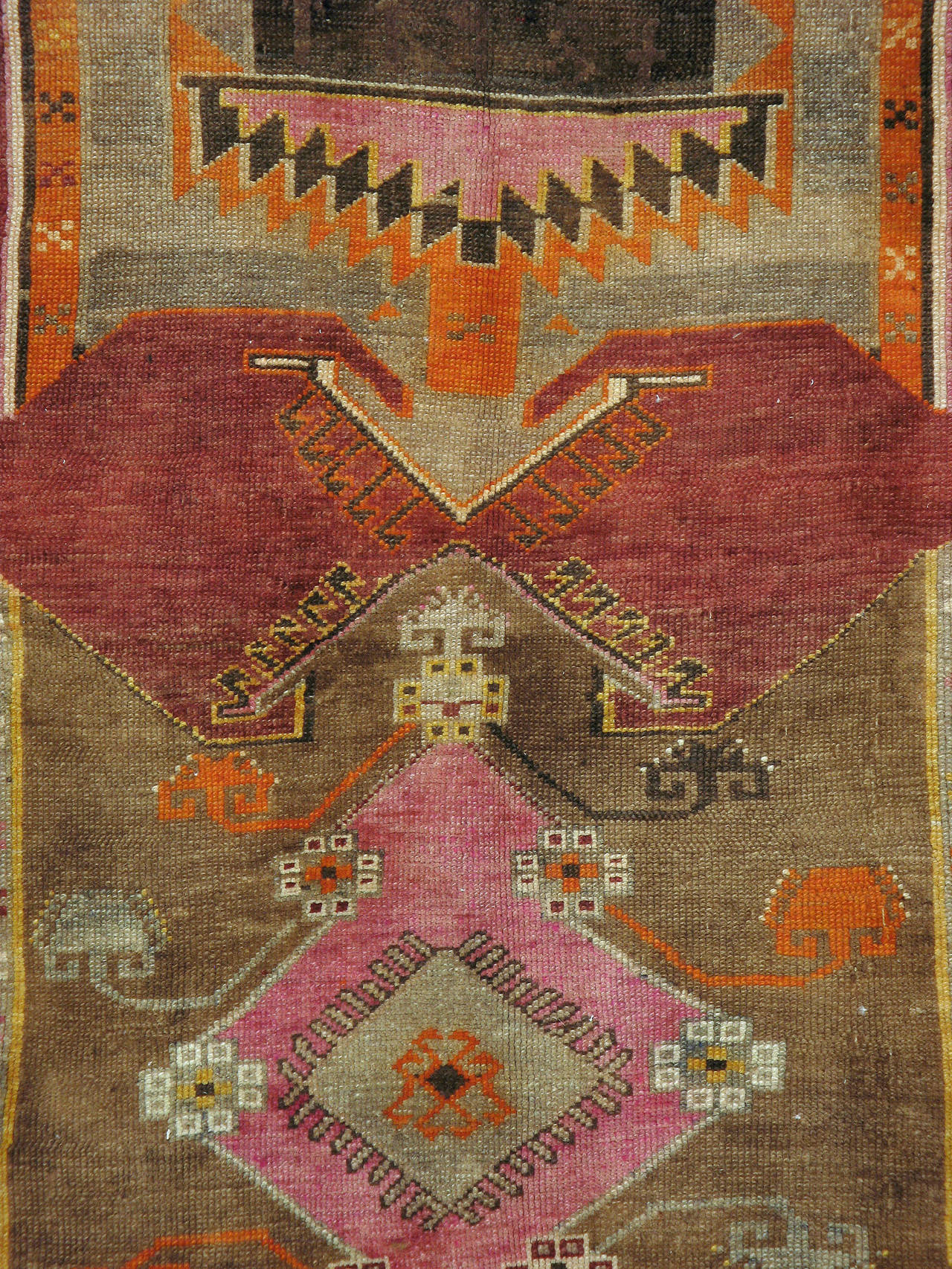 A vintage Turkish Anatolian carpet from the second quarter of the 20th century with three medallions over a marsala field.