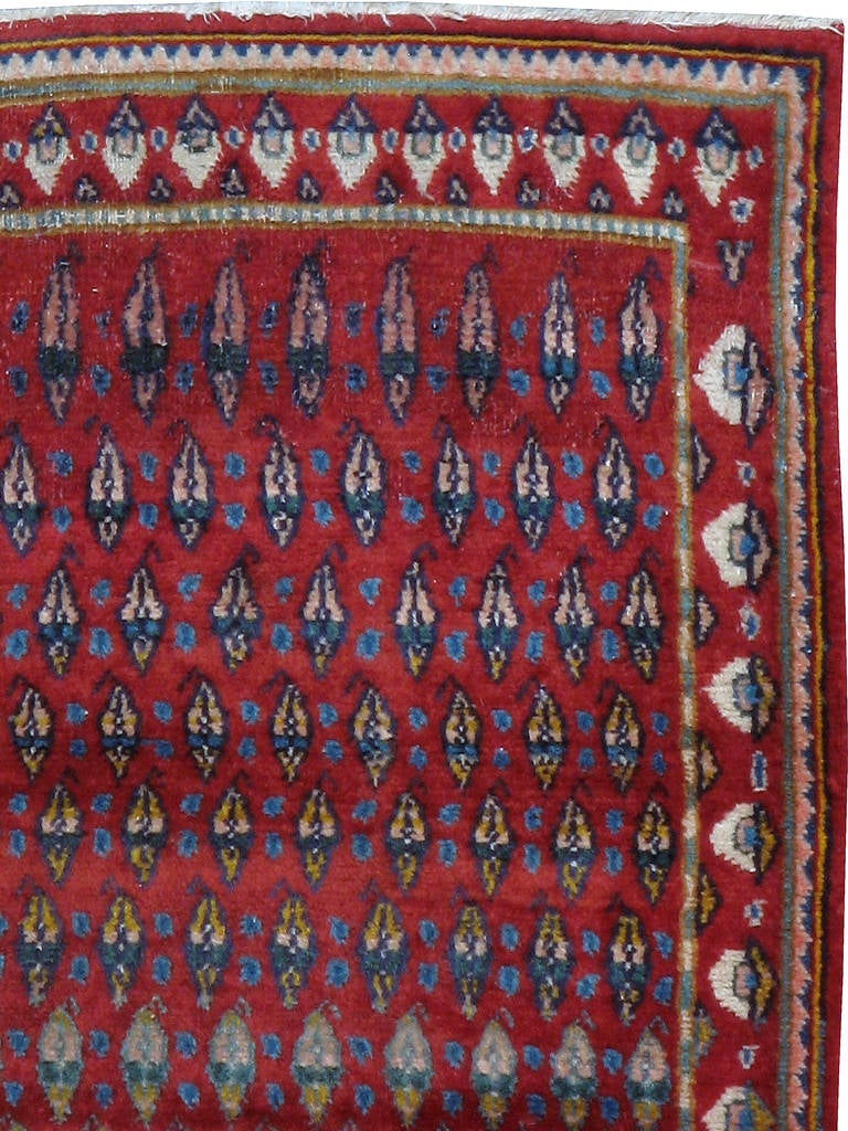 A second quarter of the 20th century vintage Persian Kashan carpet with an all-over boteh design. Boteh is also referred to as paisley design in European and Western markets.