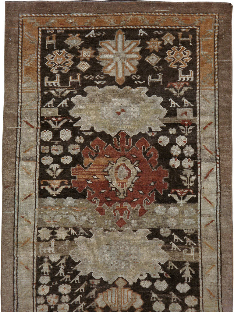 A first quarter of the 20th century Persian Kurd runner carpet.