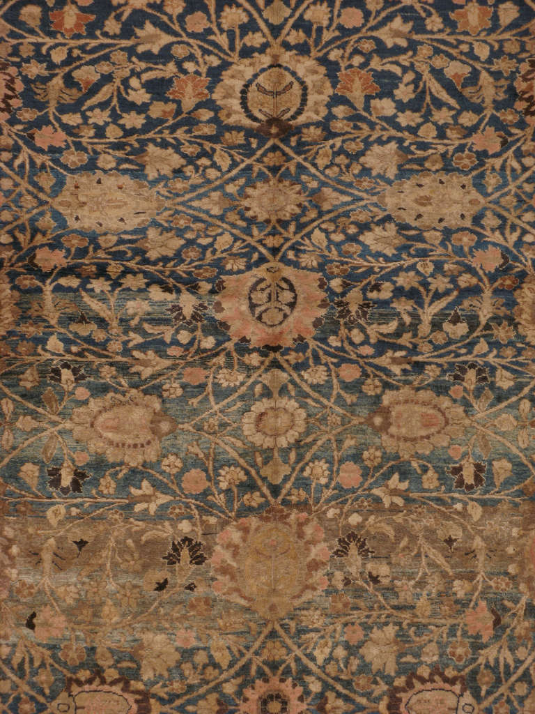 An early 20th century Persian Tabriz.  Since the 17th century, Iran started exporting artisan carpets around the world, especially to Europe.  Artists used one of the three versions of vertical looms later referred to as a Tabriz Loom.  Artists