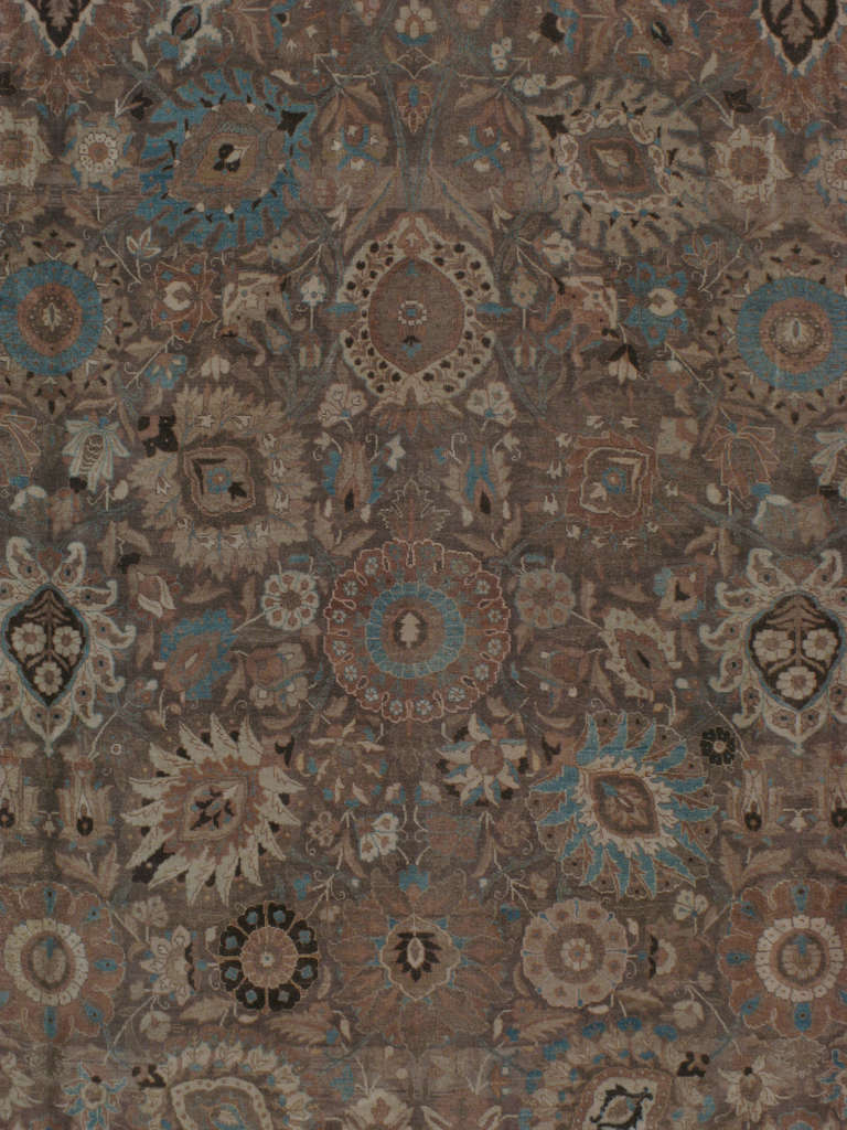 An early 20th century Persian Tabriz.  Since the 17th century, Iran started exporting artisan carpets around the world, especially to Europe.  Artists used one of the three versions of vertical looms later referred to as a Tabriz Loom.  Artists