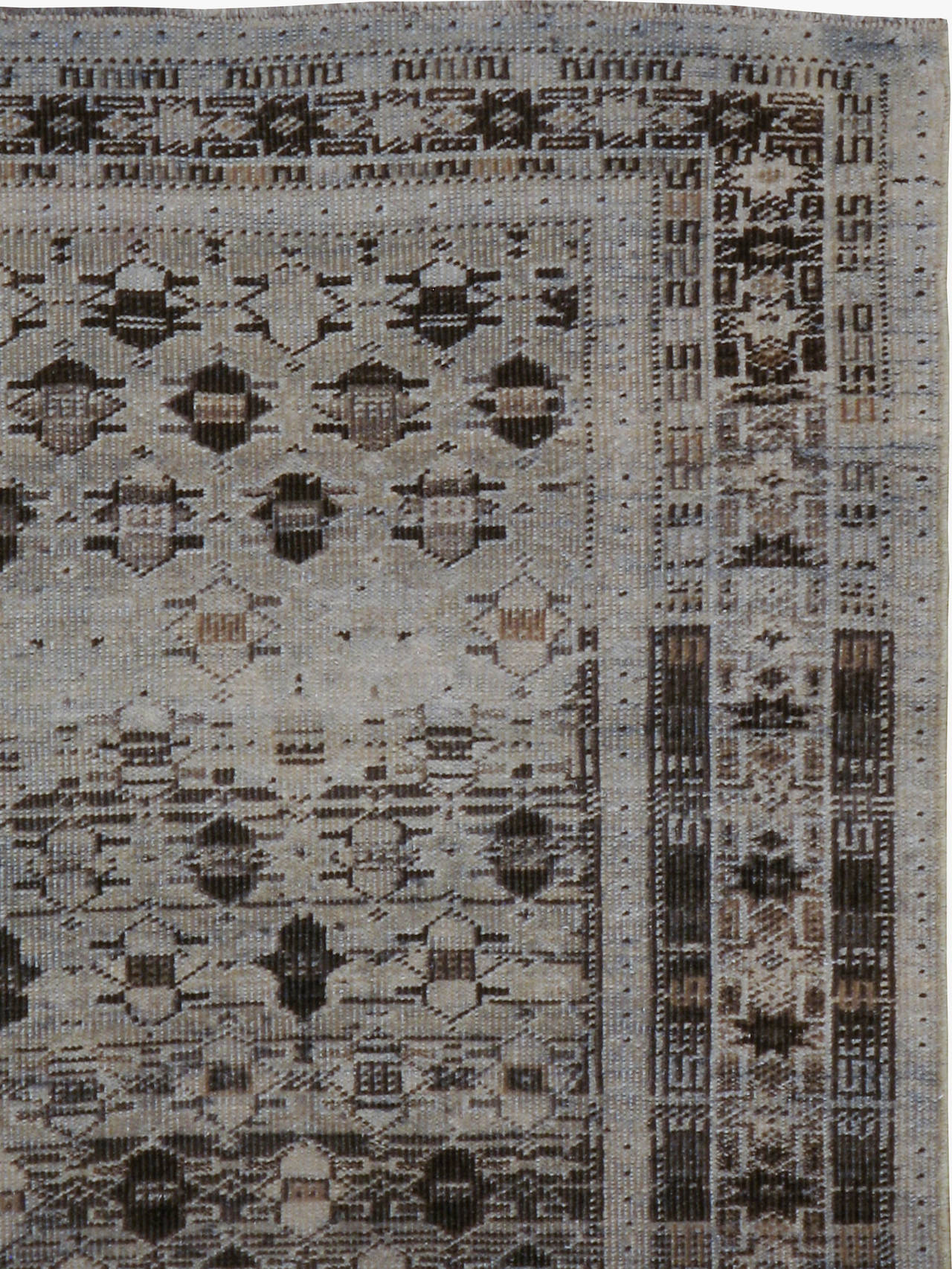 An antique Persian Baluch rug from the second quarter of the 20th century.