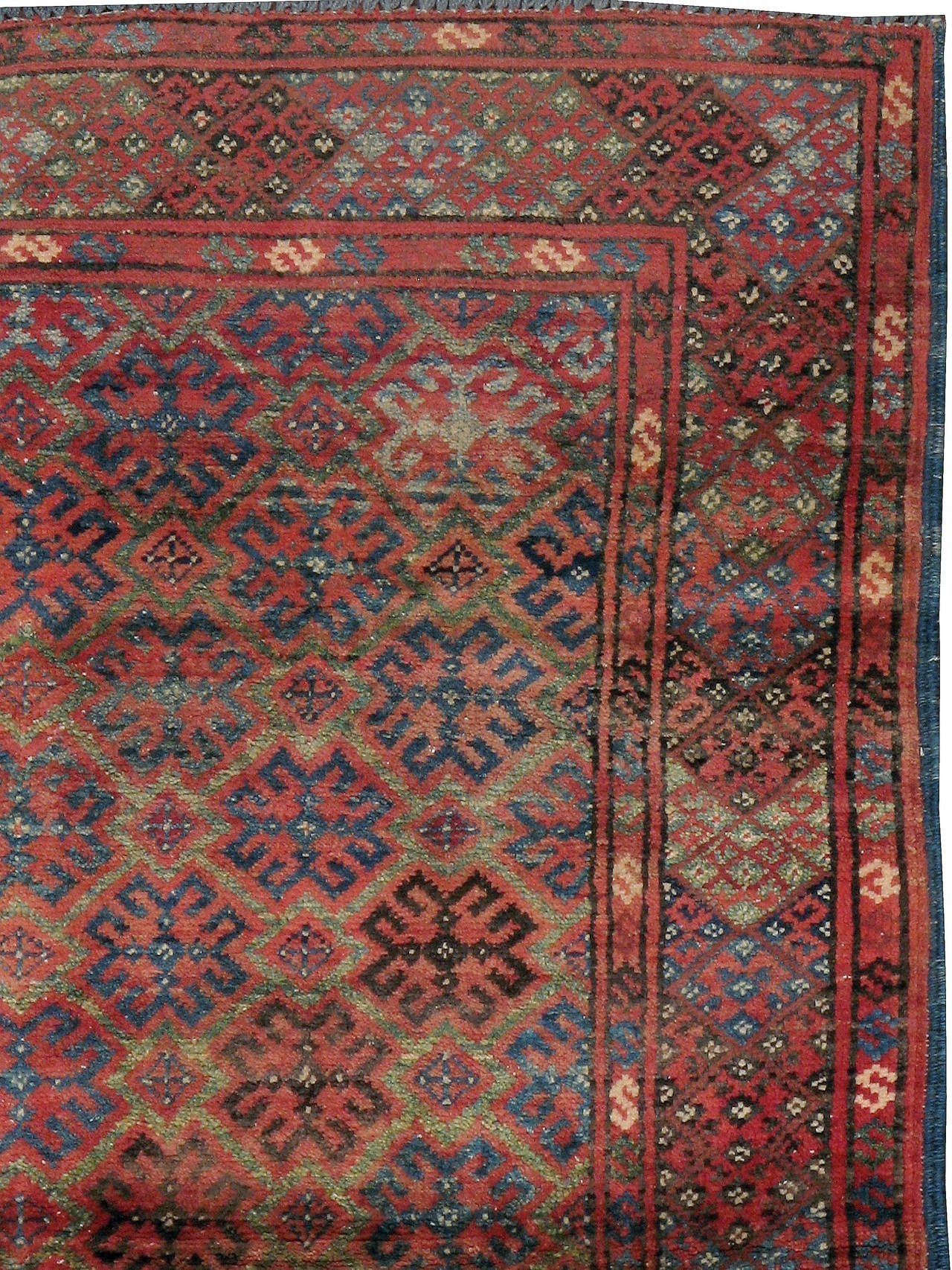 A vintage Afghan Baluch carpet from the second quarter of the 20th century.