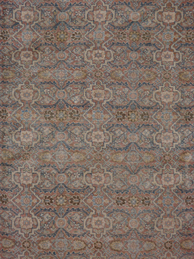 An early 20th century Persian Tabriz.	Since the 17th century, Iran started exporting artisan carpets around the world, especially to Europe.  Artists used one of the three versions of vertical looms later referred to as a Tabriz Loom.  Artists