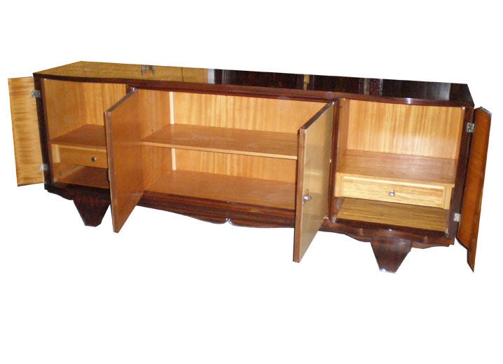 French Art Deco rosewood and parchment with interior shelves and drawers.