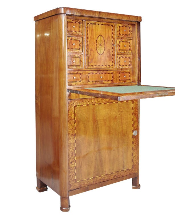 Biedermeier secretaire in walnut, root wood and ebony with fall-front writing surface; interior drawers and secret compartments.