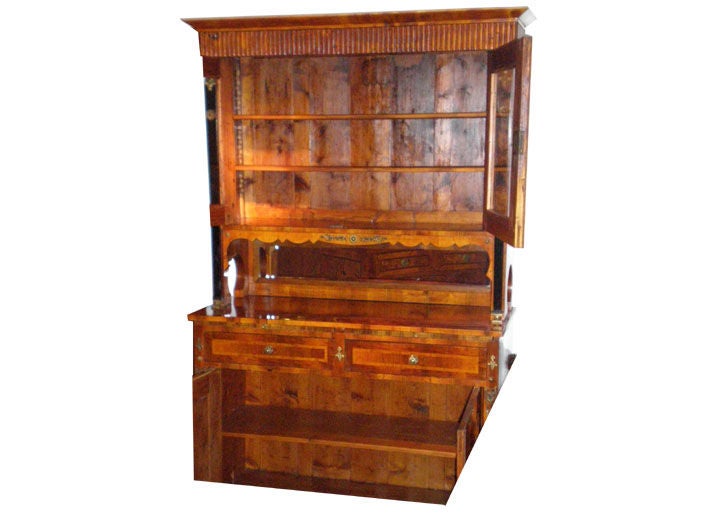 Biedermeier Credenza – walnut, maple, fruitwood and ebonized columns with gilt bronze fittings.  Upper section with 2 glazed doors and interior shelves.  Lower section with 2 drawers above 2 doors with interior shelves.