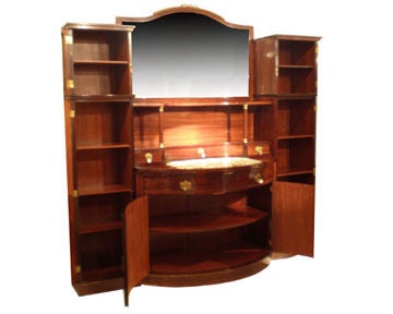 Art Deco Grand Buffet made of mahogany with rosewood and mother of pearl inlay.  Large mirror above cream and green marble top.  Beveled glass cabinet doors on either side above side cabinets with inside shelves.
