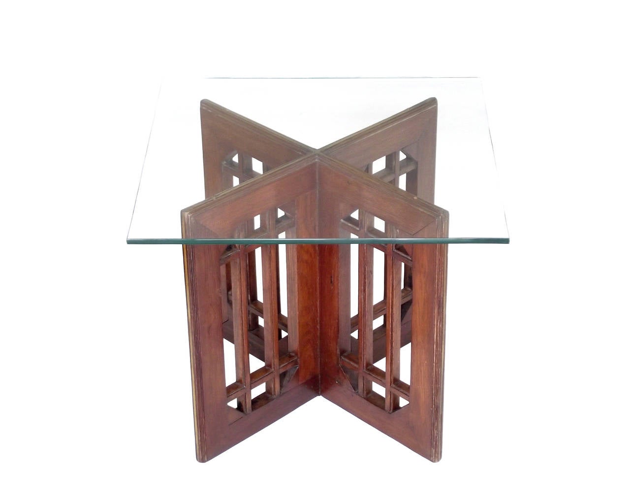 A pair of 1960s modern end tables in a cruciform shape with geometric 'church window' cut-out detail to each side, executed in solid wood (believed walnut) with inset brass trim along top and side edges. You could even add a single top to create a