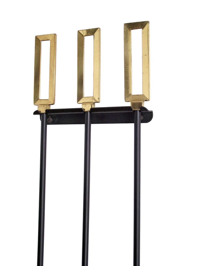 A modernist set of wall-mount fire tools with beveled, rectangular handles in solid brass. The matte black lacquer has been professionally redone while the handles retain their original patina.

***Note: Measurements shown below are the brush tool.