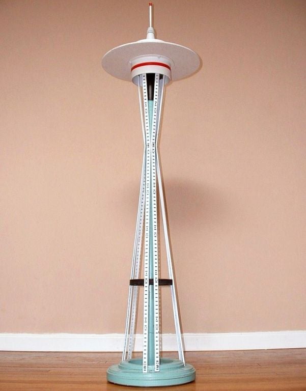 Now you can bring one of modern architecture's triumphs right into your very own home. This folk art, free-standing sculpture of the Seattle Space Needle was crafted using various scraps of building materials - - the base and center column are wood,