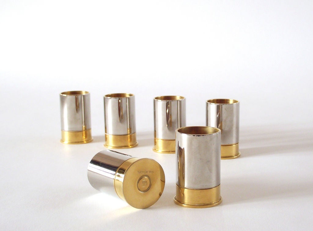 Whimsical set of six 'bullet casings' by Hermes Paris in gold and silver plate over solid brass, each signed to the underside. We believe these were originally intended as matchstick holders but they're beautiful decorative objects in their own
